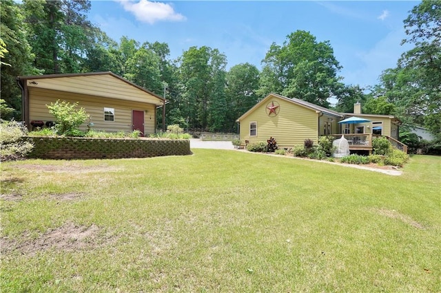 184 Bradley Rd, Jackson, GA 30233 - view of grassy yard with a deck