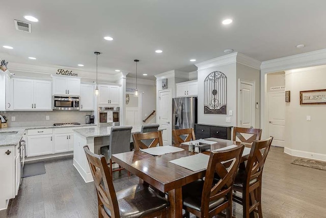 470 Wagon Hill Ln, Sugar Hill, GA 30518 - dining space featuring crown molding, dark wood-type flooring, recessed lighting, baseboards, and stairs