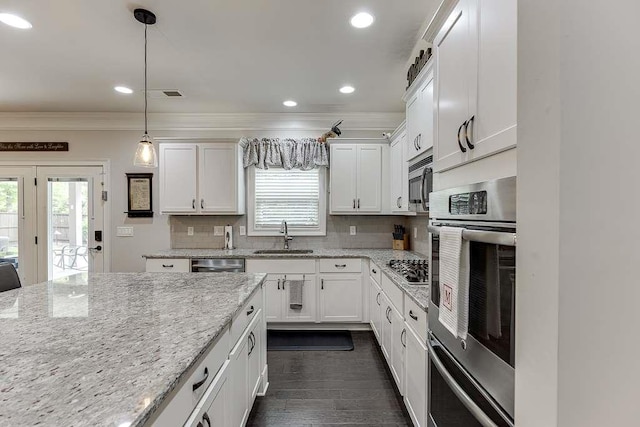470 Wagon Hill Ln, Sugar Hill, GA 30518 - kitchen with a sink, stainless steel appliances, crown molding, white cabinets, and tasteful backsplash
