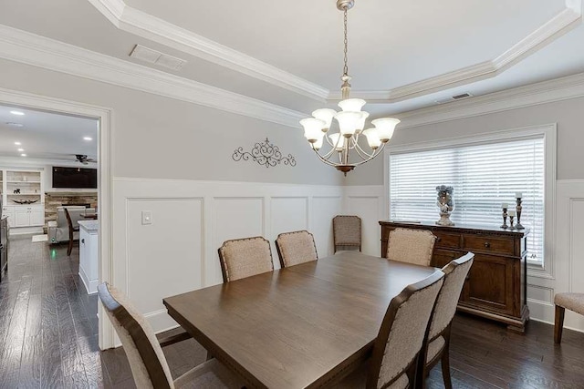 470 Wagon Hill Ln, Sugar Hill, GA 30518 - dining room featuring a decorative wall, a chandelier, a tray ceiling, dark wood-style floors, and wainscoting