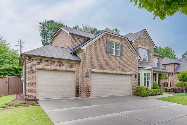 470 Wagon Hill Ln, Sugar Hill, GA 30518 - view of front of home with brick siding, concrete driveway, roof with shingles, and an attached garage