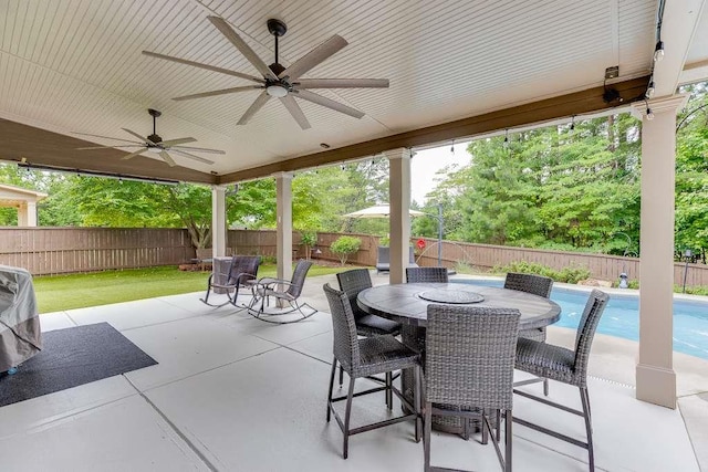 470 Wagon Hill Ln, Sugar Hill, GA 30518 - fenced backyard featuring a ceiling fan, a patio area, and outdoor dining area