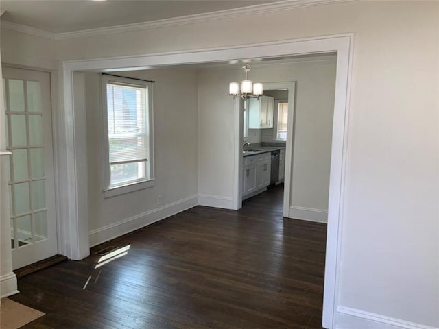 unfurnished dining area with dark wood-style floors, baseboards, visible vents, an inviting chandelier, and crown molding