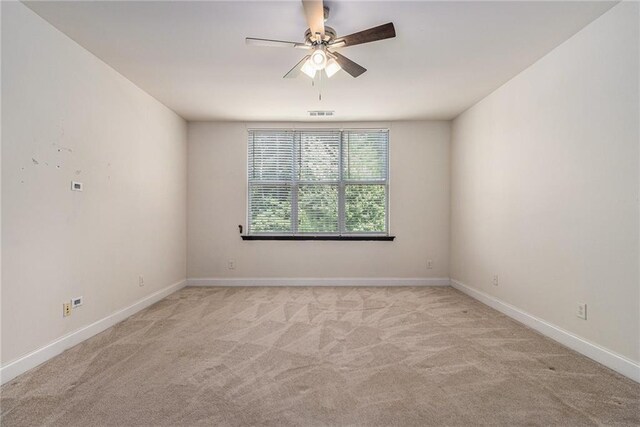 6023 Brookside Oak Cir, Norcross, GA 30093 - empty room with ceiling fan, light carpet, and baseboards