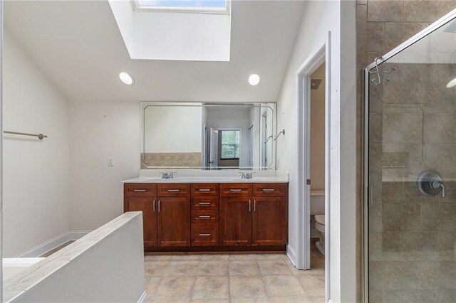 6023 Brookside Oak Cir, Norcross, GA 30093 - bathroom with toilet, a stall shower, double vanity, and recessed lighting