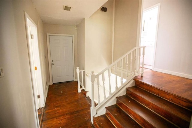 stairway featuring hardwood / wood-style floors