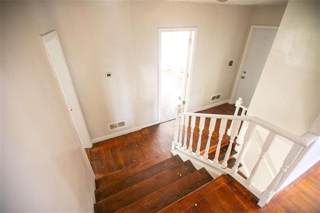 stairway with wood-type flooring