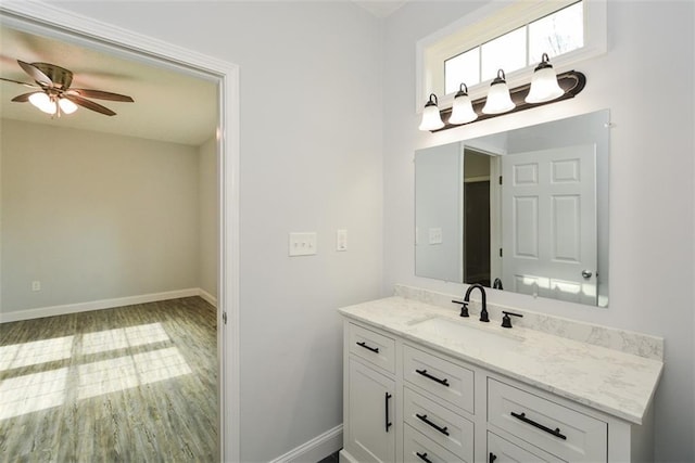 bathroom featuring vanity, wood-type flooring, and ceiling fan