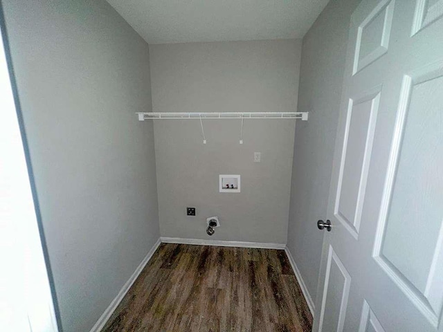 washroom with hookup for an electric dryer, washer hookup, laundry area, baseboards, and wood finished floors