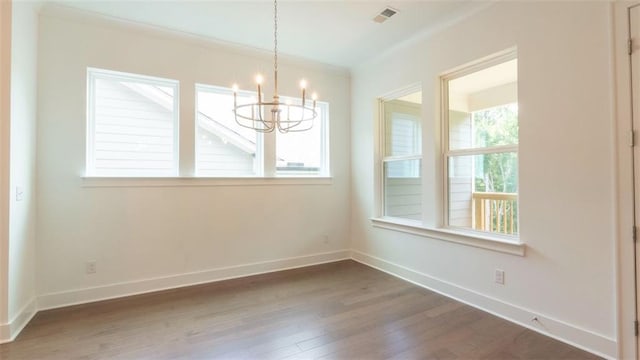 7020 Cottage Grove Dr, Flowery Branch, GA 30542 - unfurnished room with a chandelier, wood finished floors, and crown molding