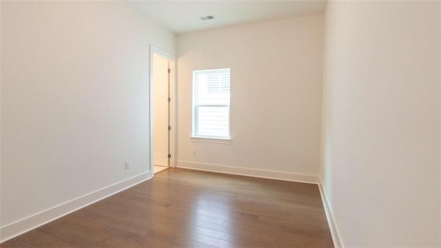 7020 Cottage Grove Dr, Flowery Branch, GA 30542 - spare room featuring dark wood-type flooring and baseboards
