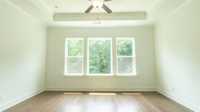 7020 Cottage Grove Dr, Flowery Branch, GA 30542 - spare room with a raised ceiling, wood finished floors, ceiling fan, and ornamental molding