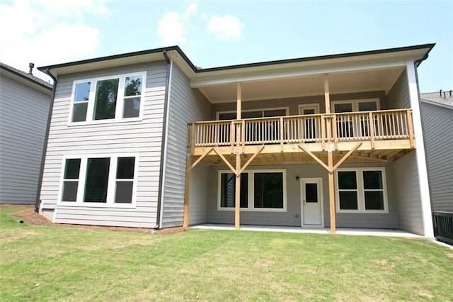 7020 Cottage Grove Dr, Flowery Branch, GA 30542 - back of house with a lawn, a patio, and a balcony