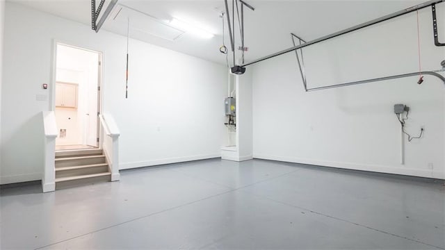 7020 Cottage Grove Dr, Flowery Branch, GA 30542 - garage featuring water heater and a garage door opener