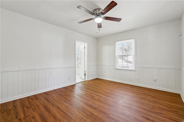 empty room with hardwood / wood-style flooring and ceiling fan