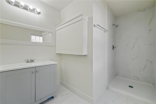 bathroom featuring vanity and tiled shower