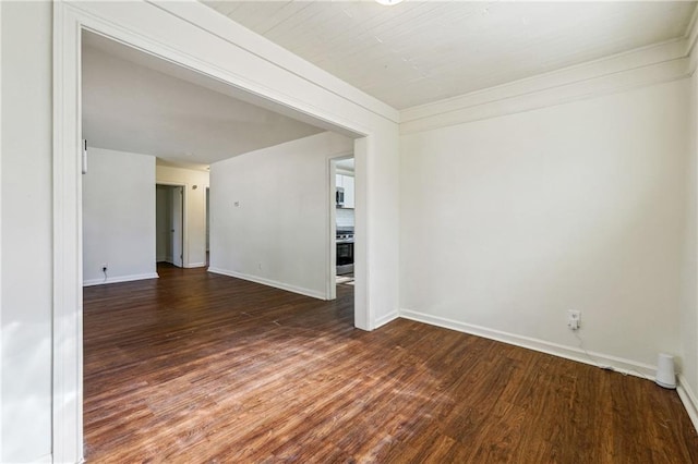 spare room featuring dark hardwood / wood-style floors