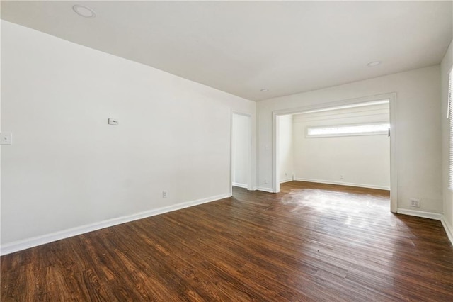 empty room featuring dark hardwood / wood-style floors