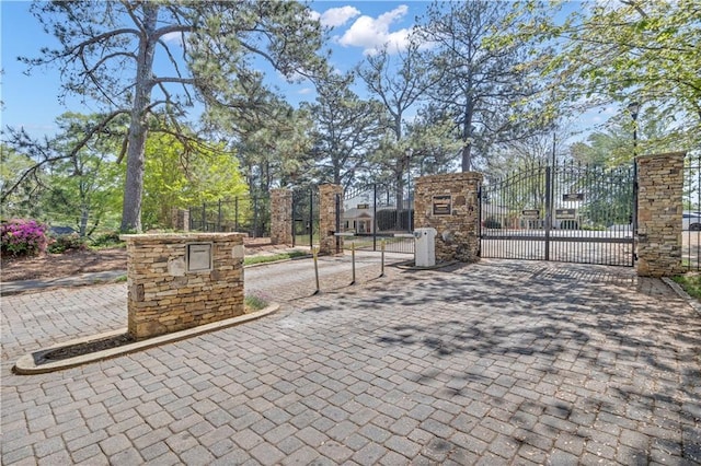 view of gate with fence