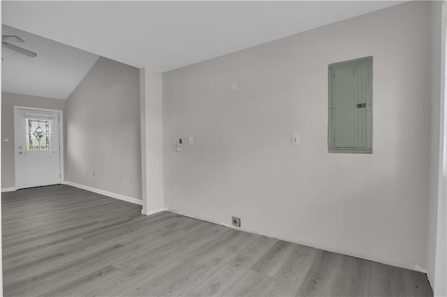 unfurnished room featuring wood finished floors and electric panel