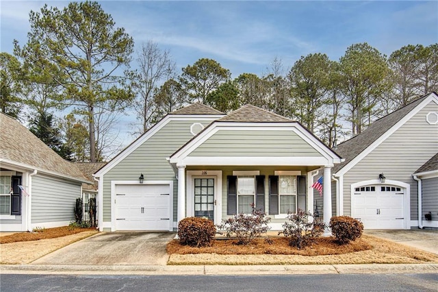 view of front of property with covered porch and a garage