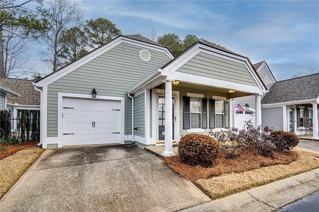 view of front of property featuring a porch and a garage