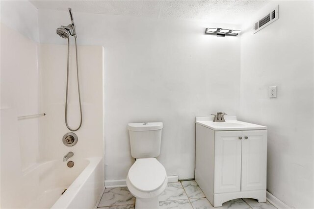 bathroom featuring marble finish floor, visible vents, toilet, a textured ceiling, and baseboards