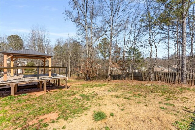 view of yard with fence and a gazebo