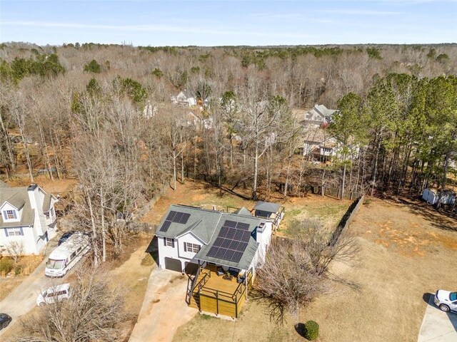 bird's eye view featuring a wooded view