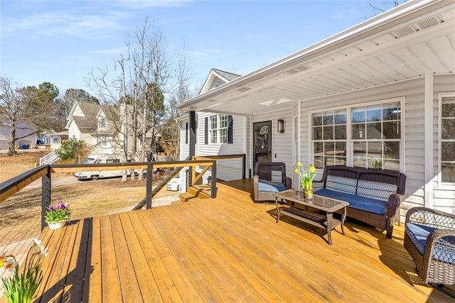 wooden terrace featuring outdoor lounge area