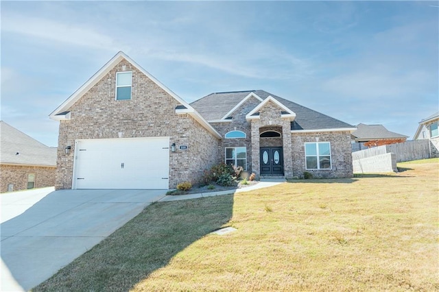 view of front facade featuring a garage and a front lawn