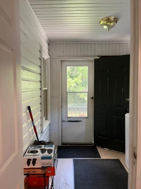 entryway with hardwood / wood-style flooring