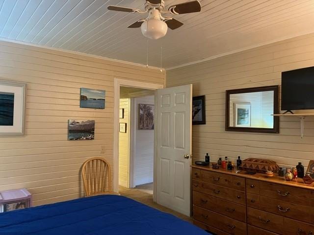 bedroom featuring crown molding, wooden ceiling, and ceiling fan