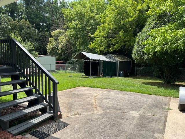 view of patio / terrace with a shed