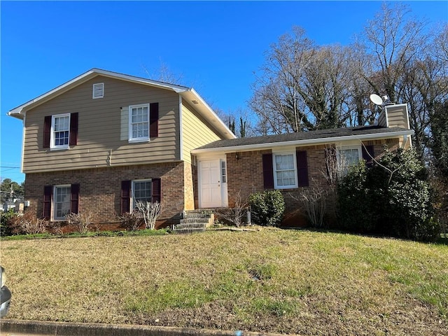 split level home featuring a front yard