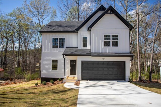 modern inspired farmhouse with a garage