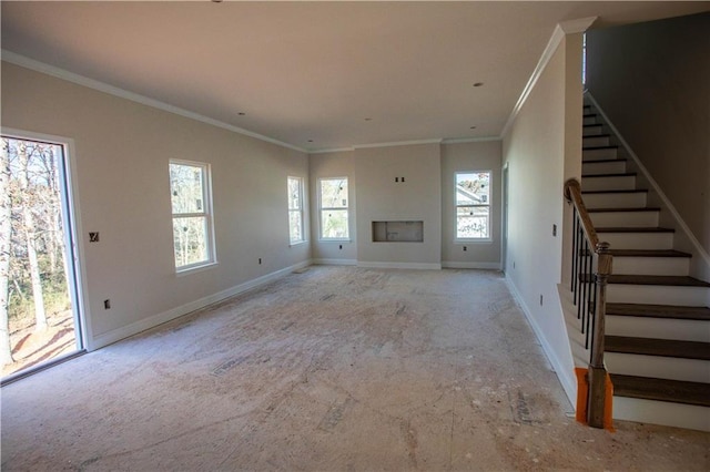 unfurnished living room featuring crown molding