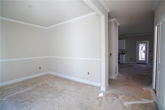 unfurnished room featuring crown molding