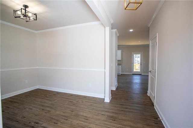 corridor featuring baseboards, dark wood finished floors, ornamental molding, a notable chandelier, and recessed lighting