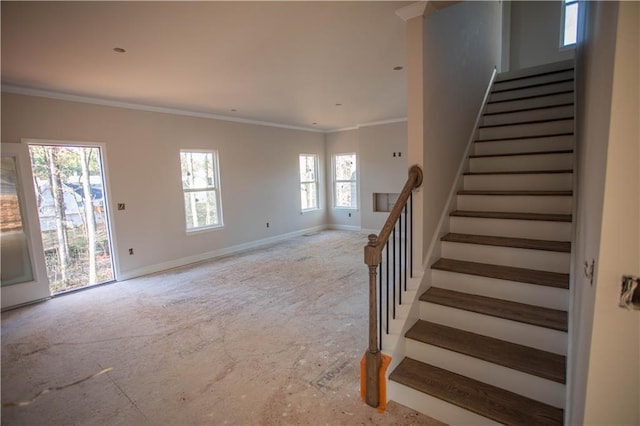 staircase featuring crown molding