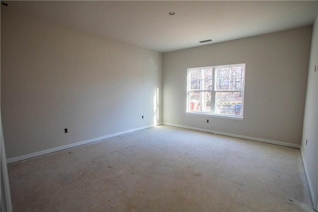 empty room with visible vents and baseboards