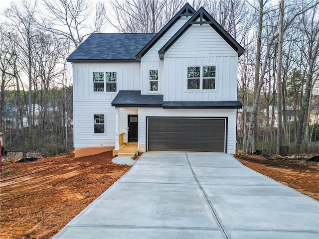 modern farmhouse style home featuring a garage