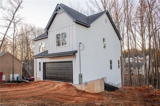 view of property exterior with a garage