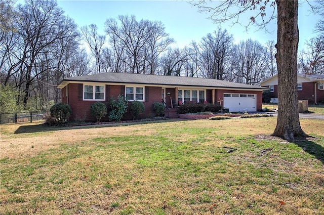 single story home with brick siding, a front lawn, an attached garage, and fence