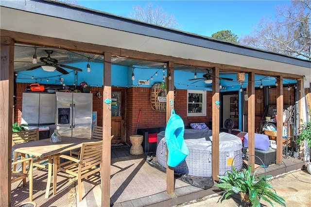 view of patio featuring ceiling fan