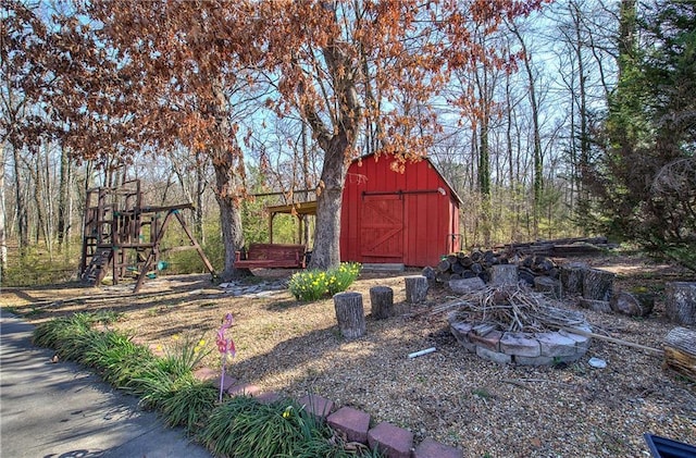 view of outbuilding featuring an outbuilding and a playground