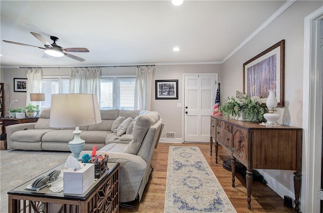 living room with wood finished floors, baseboards, recessed lighting, ceiling fan, and crown molding