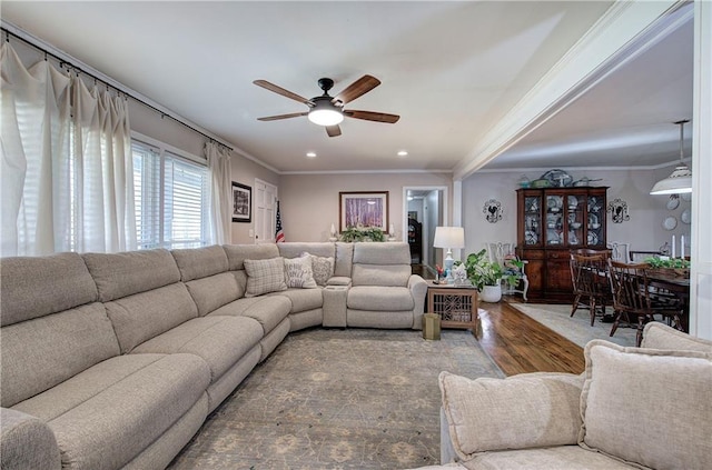 living area featuring recessed lighting, a ceiling fan, wood finished floors, and crown molding