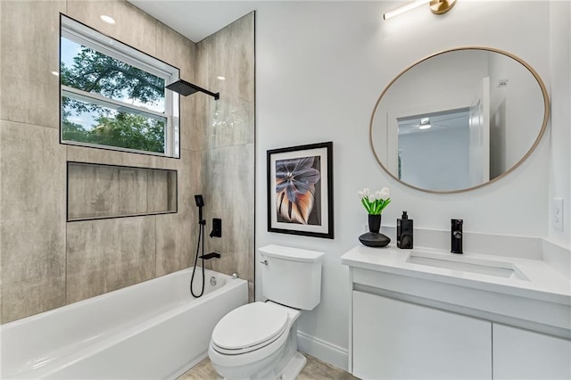 full bathroom with vanity, toilet, and tiled shower / bath