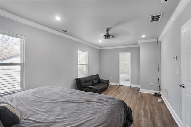 bedroom featuring wood finished floors, visible vents, baseboards, recessed lighting, and crown molding